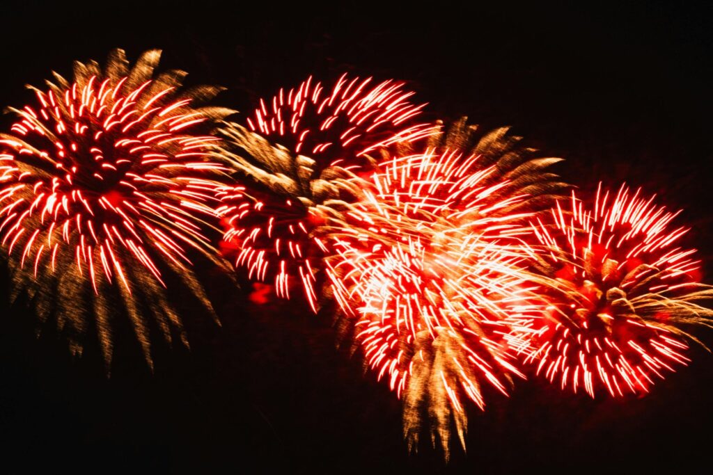 A vibrant and colorful fireworks display lighting up the night sky.